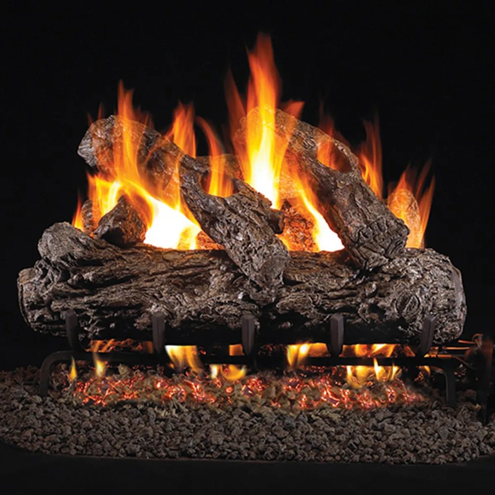 Gas log set burning in a fireplace